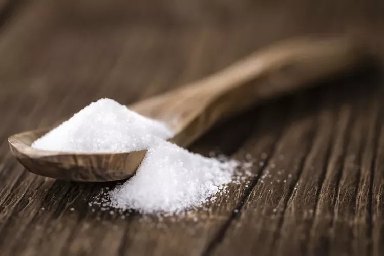 spoonful of white refined sugar