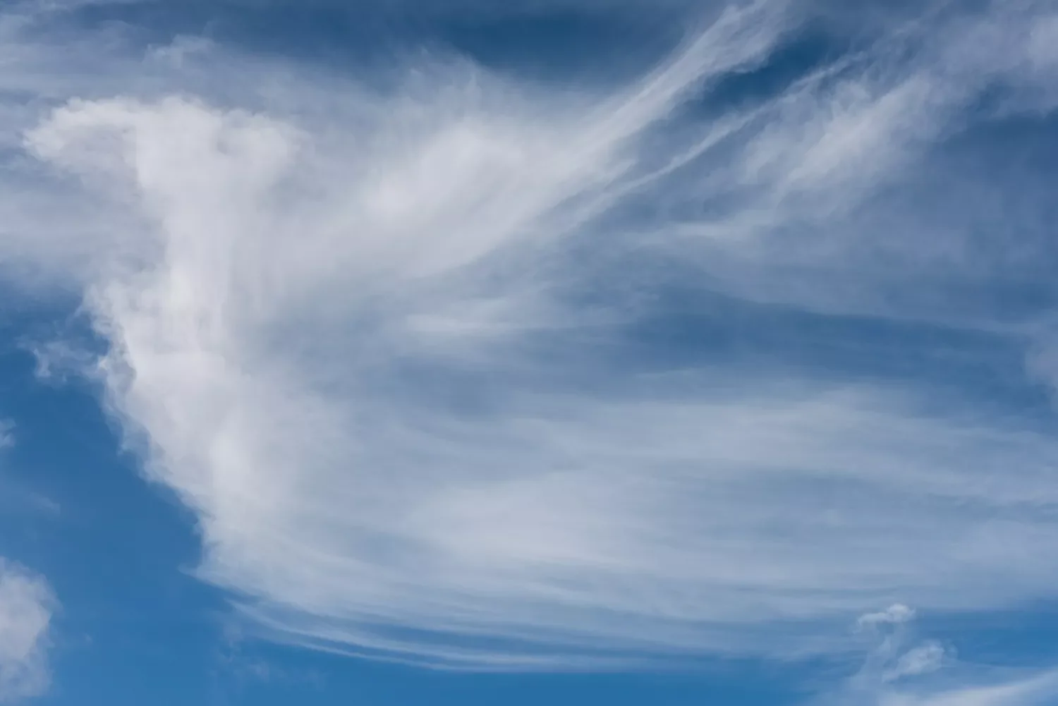 Cirrostratus clouds create a veil over the moon and sun.Tim Grist Photography / Getty Images